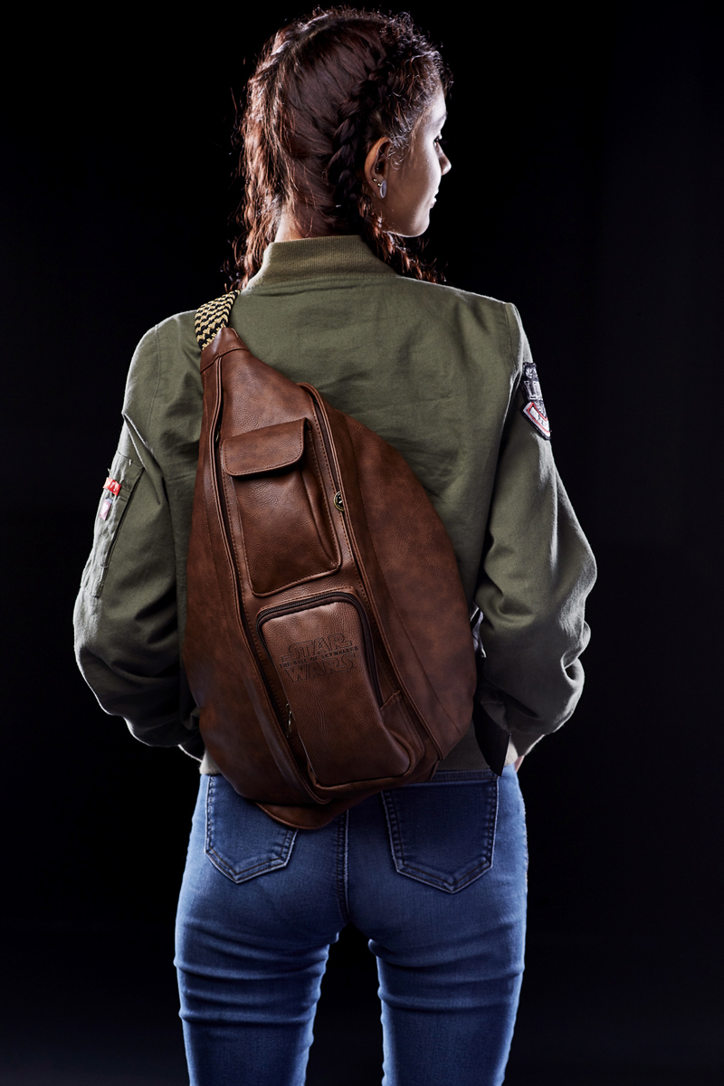 Girl wears leather backpack